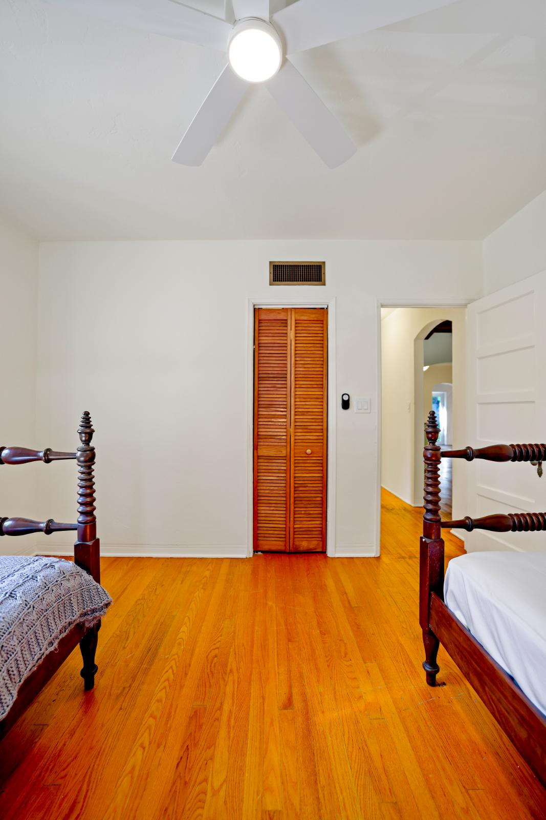 Living room with fireplace and exposed wood ceiling